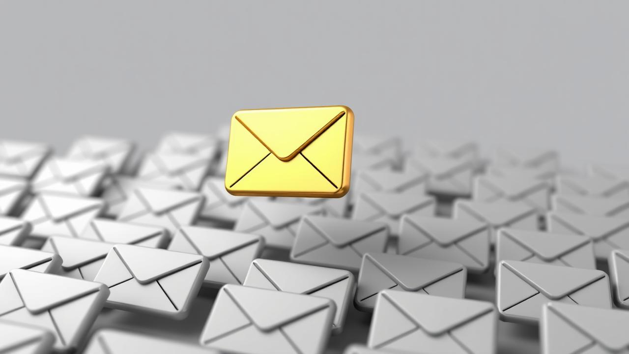 A single golden email envelope stands out above a crowd of generic grey envelopes, symbolizing a successful or standout email.